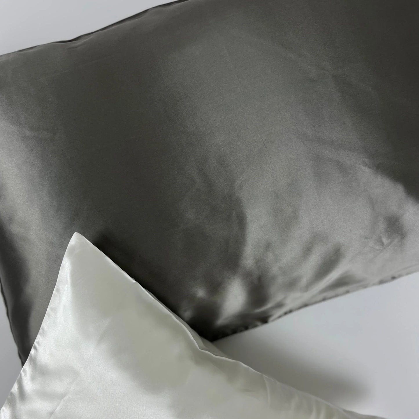 Dark gray charcoal pillowcase on bed setting
