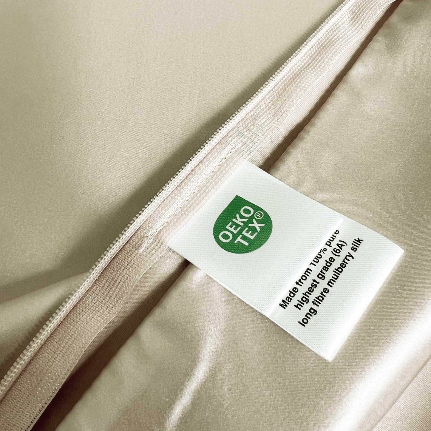 Label with Oeko-Tex logo on a beige champagne background