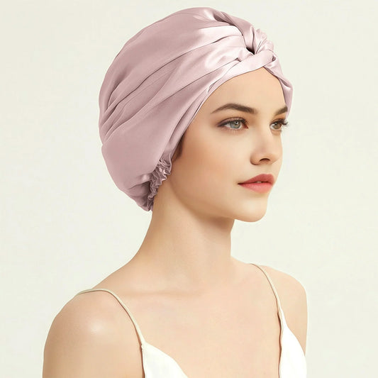 Model wearing pink silk sleep bonnet – side view