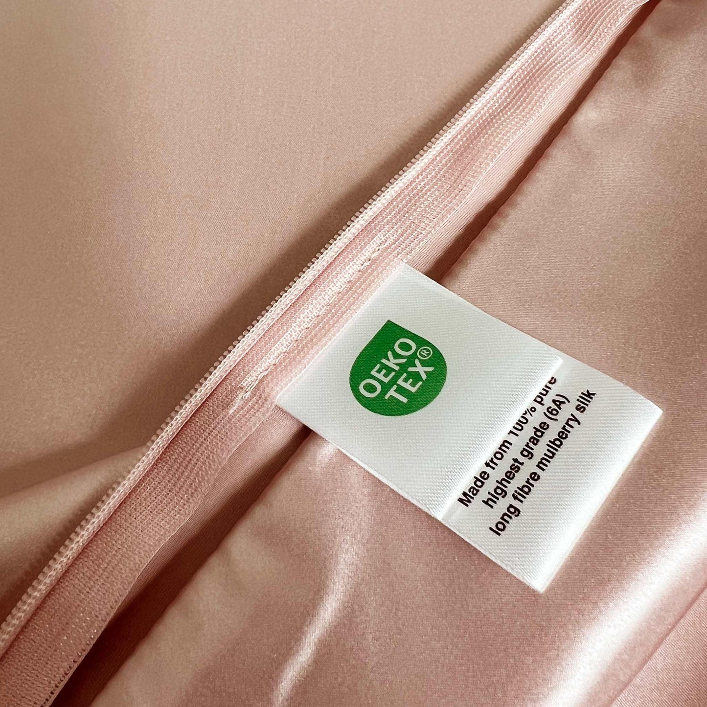 OEKO-TEX label on rose pink silk fabric