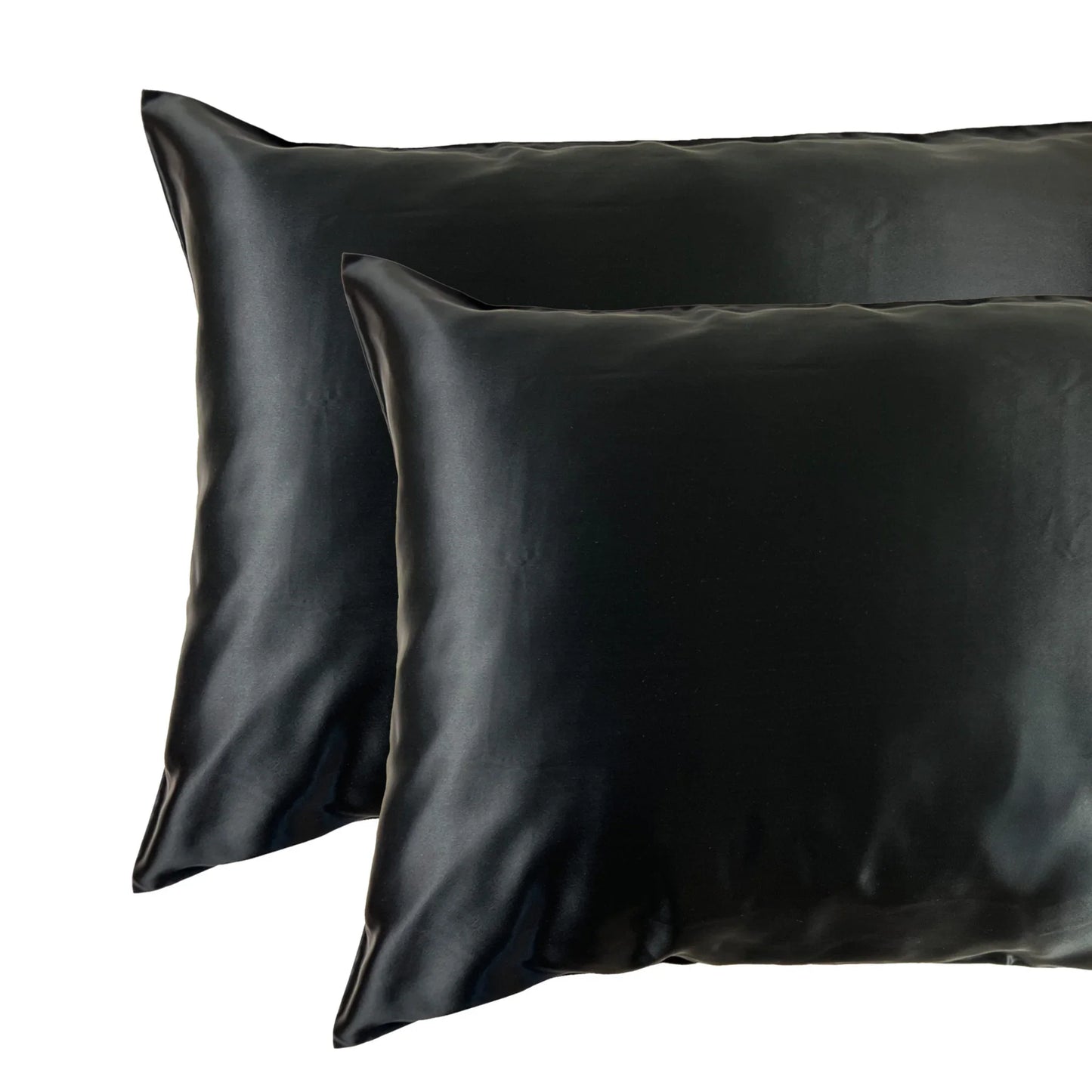 Set of 2 silk pillow cases in black – on pillow and stacked
