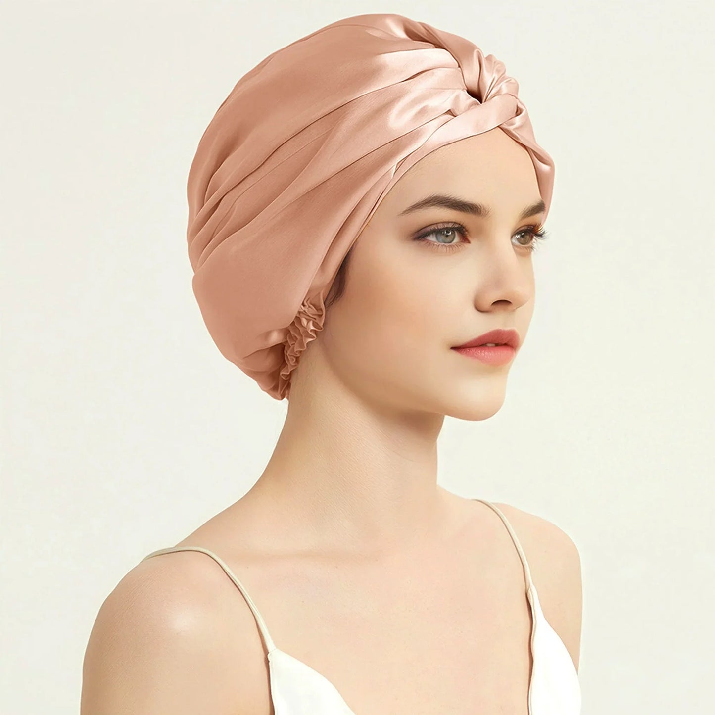 Silk hair bonnet for sleeping – rose gold on woman
