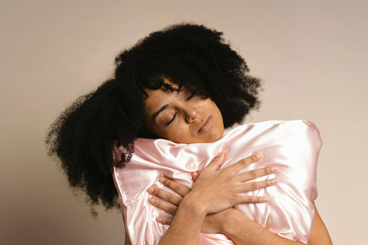 Woman holding a silk pillow