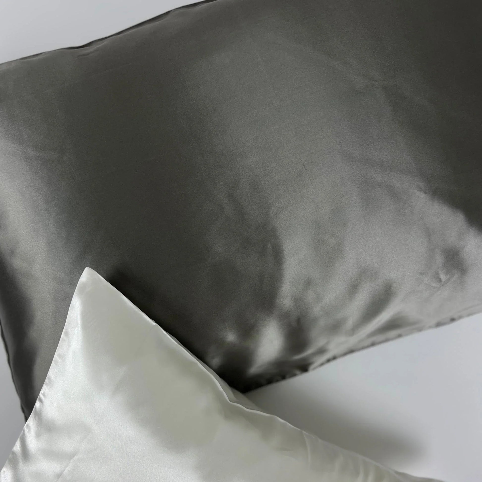 Dark gray charcoal pillowcase on bed setting